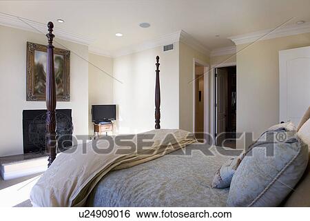 Stock Photograph - Four-poster bed in master bedroom, Laguna Beach, California, USA. Fotosearch