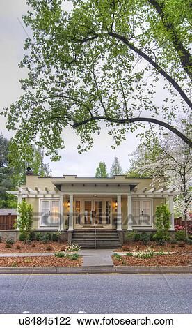 Stock Image - Front exterior California Bungalow and landscaping; Chico; California; USA. Fotosearch