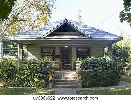 Stock Image - Front exterior green bungalow; Chico; California; USA. Fotosearch