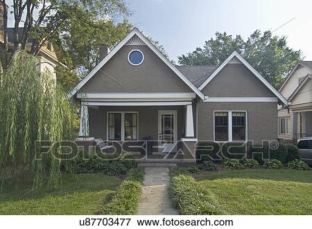 Front exterior of a one story bungalow with white trim at Nashville; Tennessee; USA View Large Photo Image Stock Photo - Front exterior of a one story bungalow with white trim at Nashville; Tennessee; USA. Fotosearch