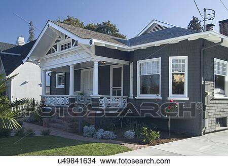 Picture - Front exterior view of a blue bungalow with white trim; Redwood City; California; USA. Fotosearch