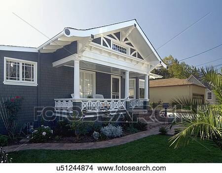Picture - Front exterior view of a blue bungalow with white trim; Redwood City; California; USA. Fotosearch
