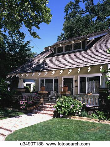 Front exterior view of a yellow craftsman house with white trim; Sacramento; California; USA View Large Photo Image Stock Photo - Front exterior view of a yellow craftsman house with white trim; Sacramento; California; USA. Fotosearch