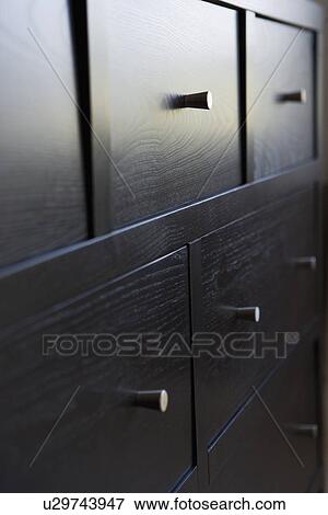 Front of contemporary dresser with small knobs View Large Photo Image Stock Photo - Front of contemporary dresser with small knobs. Fotosearch