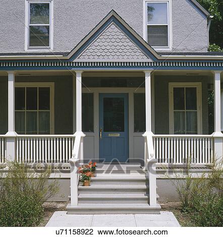 Front porch of gray stucco house with dark blue trim Stock ...