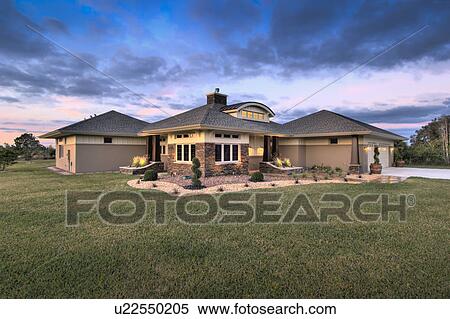 Stock Photography - Front yard and exterior of custom home. Fotosearch