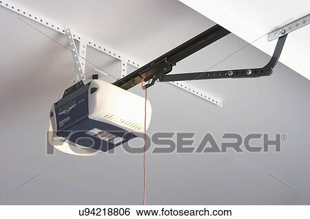 GARAGE DETAIL: door opener with light View Large Photo Image Stock Photograph - GARAGE DETAIL: door opener with light. Fotosearch