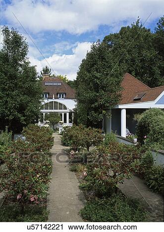 Garden view to greenhouse. Sergeant crabapple trees line the walkway, pavilion to the right View Large Photo Image Stock Image - Garden view to greenhouse. Sergeant crabapple trees line the walkway, pavilion to the right. Fotosearch
