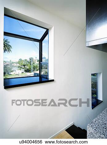 Stock Photograph - Garden window in modern home. Fotosearch