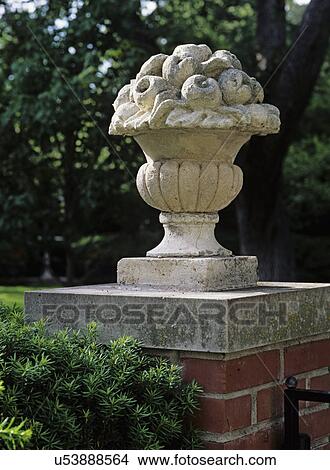 Gardens A Salvaged Decorative Urn Italian Sits On Top Of Brick
