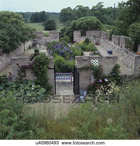 Gardens: Country flower garden in and around the stone foundation of a demolished barn, overview of area. View Large Photo Image Stock Image - Gardens: Country flower garden in and around the stone foundation of a demolished barn, overview of area. . Fotosearch