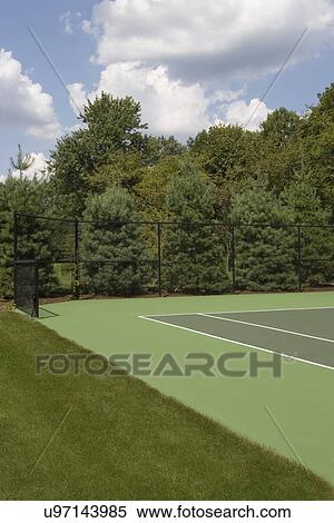 GARDENS: tennis court with fence and tree line View Large Photo Image Stock Photography - GARDENS: tennis court with fence and tree line. Fotosearch