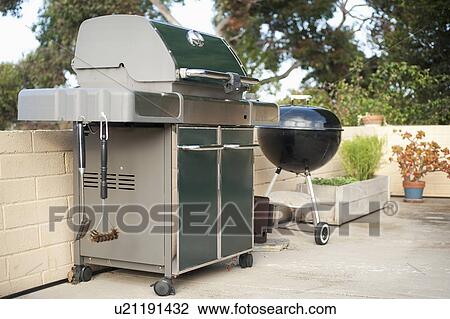 Gas grill and barbecue grill in yard View Large Photo Image Stock Image - Gas grill and barbecue grill in yard. Fotosearch