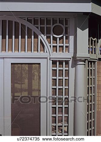 Stock Photography - Gazebos: Detail shot that shows the intricate wood work used to create gazebo. Green painted wood. Very geometric.. Fotosearch