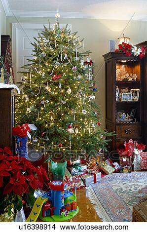 Gift boxes and toys with decorated Christmas tree View Large Photo Image Picture - Gift boxes and toys with decorated Christmas tree. Fotosearch