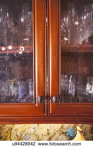 Glass front cabinets; Laguna Beach; California; USA View Large Photo Image Stock Image - Glass front cabinets; Laguna Beach; California; USA. Fotosearch