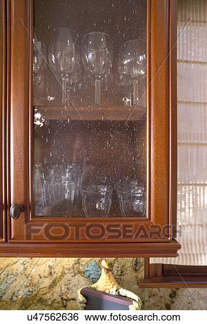 Stock Photograph - Glass front cabinets; Laguna Beach; California; USA. Fotosearch