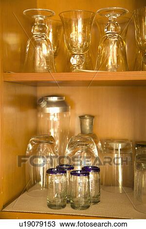 Glass on shelves in cabinet; Carpinteria; California; USA View Large Photo Image Stock Image - Glass on shelves in cabinet; Carpinteria; California; USA. Fotosearch