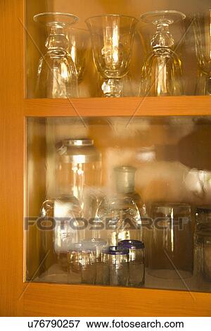 Glass on shelves in cabinet; Carpinteria; California; USA View Large Photo Image Stock Photo - Glass on shelves in cabinet; Carpinteria; California; USA. Fotosearch