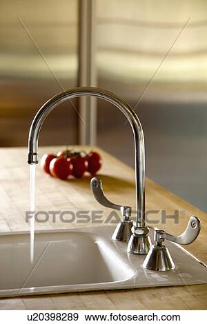 Gooseneck faucet with running water; Carpinteria; California; USA View Large Photo Image Stock Photo - Gooseneck faucet with running water; Carpinteria; California; USA. Fotosearch