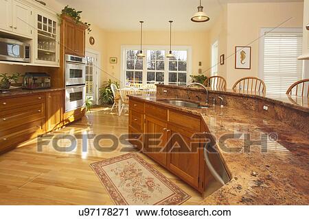 Granite Countertop In Domestic Kitchen With Hardwood Flooring