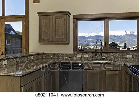 Granite countertop in kitchen with mountain view View Large Photo Image Stock Image - Granite countertop in kitchen with mountain view. Fotosearch