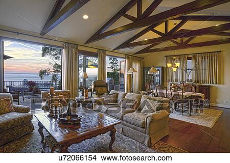 Great room with large windows at sunset, Laguna Beach, California, USA View Large Photo Image Picture - Great room with large windows at sunset, Laguna Beach, California, USA. Fotosearch