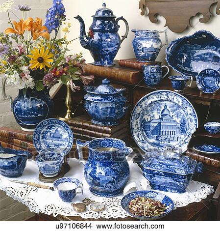Group of blue transfer ware with flowers displayed on table View Large Photo Image Picture - Group of blue transfer ware with flowers displayed on table. Fotosearch