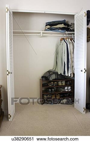 Stock Image - Half empty closet, San Diego, California, United States of America. Fotosearch