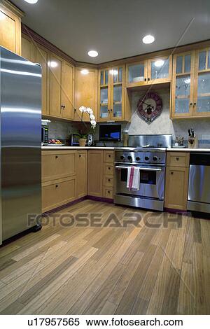 Stock Photography - Hardwood floor in traditional kitchen, Laguna Beach, California, USA. Fotosearch