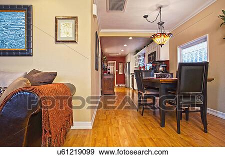 Stock Photo - Hardwood floors through dining room and kitchen, Laguna Beach, California, USA. Fotosearch