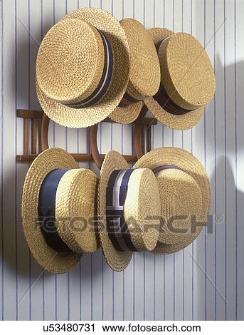 HAT COLLECTION DISPLAY: Men's vintage straw hats on a wall rack, striped wallpaper View Large Photo Image Stock Image - HAT COLLECTION DISPLAY: Men's vintage straw hats on a wall rack, striped wallpaper . Fotosearch