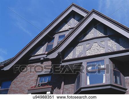 Stock Image - High section of residential house against sky. Fotosearch