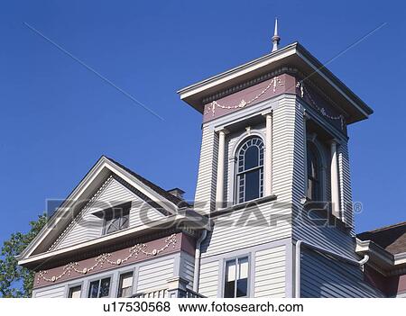 High section of residential structure against blue sky View Large Photo Image Stock Photo - High section of residential structure against blue sky. Fotosearch
