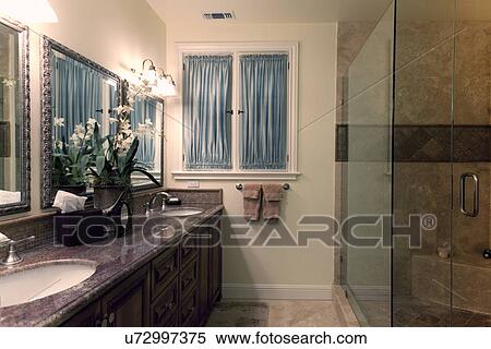 Stock Photography - His and her sinks in contemporary bathroom; Laguna Beach; California; USA. Fotosearch