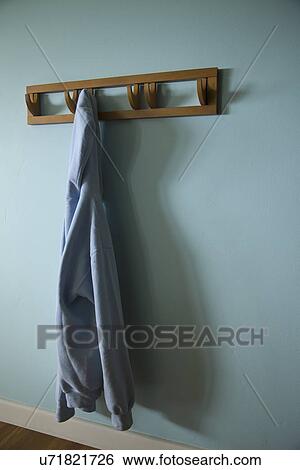 Hooded sweatshirt hanging on wall hook; Carpinteria; California; USA View Large Photo Image Stock Photograph - Hooded sweatshirt hanging on wall hook; Carpinteria; California; USA. Fotosearch