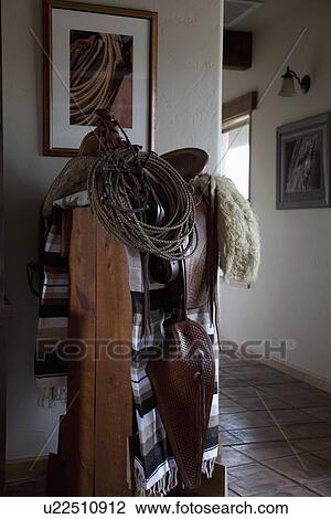 Horse saddle on stand in home; Porterville; California; USA View Large Photo Image Stock Image - Horse saddle on stand in home; Porterville; California; USA. Fotosearch