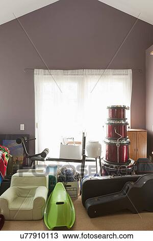 Stock Image - Instruments and clutter stacked in extra room; Burbank; California; USA. Fotosearch