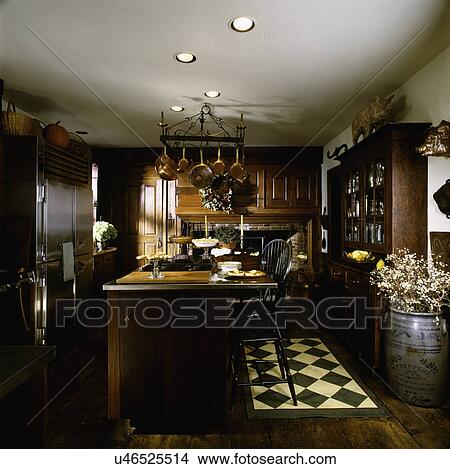 Picture - Interior of a contemporary kitchen with arranged cooking island, USA. Fotosearch