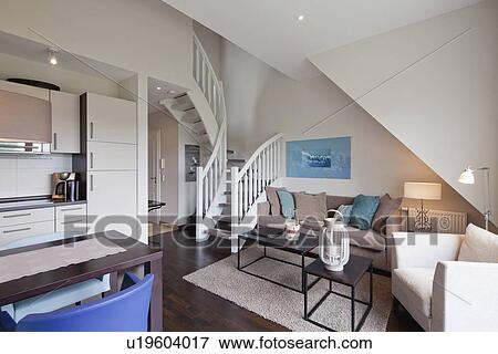 Stock Photo - Interior of a contemporary living room with staircase. Fotosearch