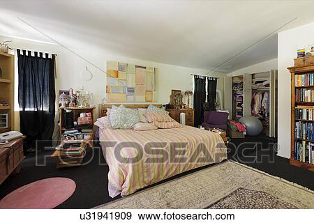 Interior of bedroom with shelves and windows View Large Photo Image Stock Photo - Interior of bedroom with shelves and windows. Fotosearch