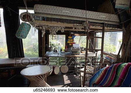 Interior of cottage consisting of typewriter on table with mattress above View Large Photo Image Stock Image - Interior of cottage consisting of typewriter on table with mattress above. Fotosearch