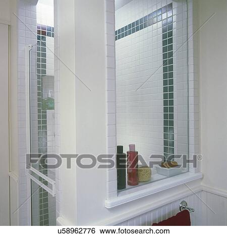 Stock Photograph - Interior of domestic bathroom with glass-walled shower stall. Fotosearch