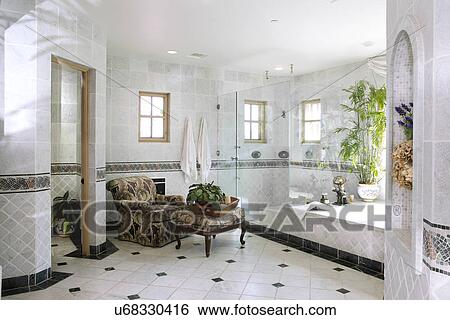 Interior of domestic bathroom with armchair and stool, California, USA View Large Photo Image Stock Photograph - Interior of domestic bathroom with armchair and stool, California, USA. Fotosearch