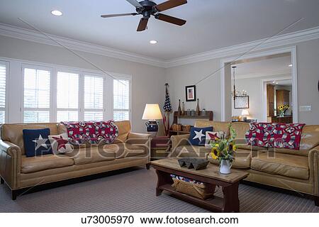 Interior of living room with leather furniture and ceiling fan View Large Photo Image Stock Image - Interior of living room with leather furniture and ceiling fan. Fotosearch