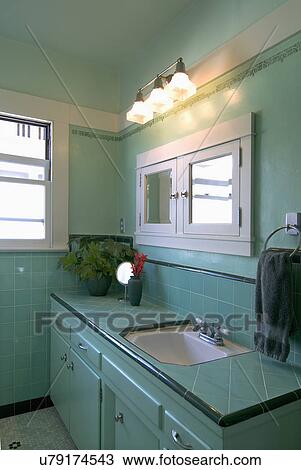 Stock Image - Interior shot of aquamarine bathroom; San Diego; California; USA. Fotosearch
