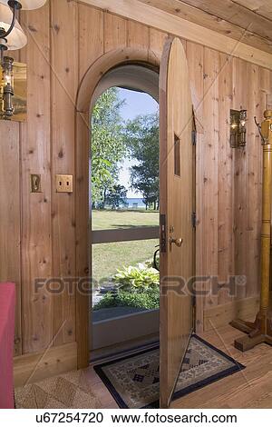 Interior view of front door looking outside in cabin style home; Charlevoix; Missouri; USA View Large Photo Image Stock Image - Interior view of front door looking outside in cabin style home; Charlevoix; Missouri; USA. Fotosearch