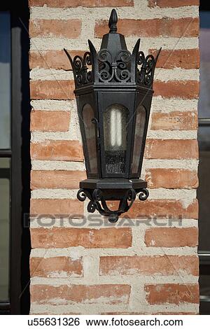 Italianate lantern style sconce on brick wall; Irvine; California; USA View Large Photo Image Stock Photograph - Italianate lantern style sconce on brick wall; Irvine; California; USA. Fotosearch