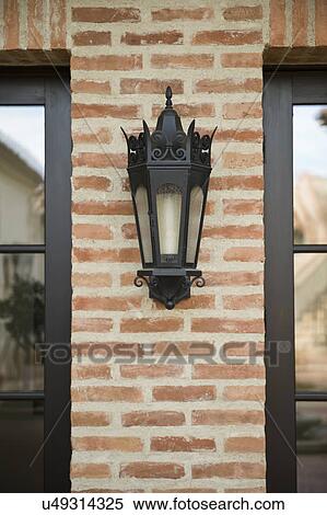 Italianate lantern style sconce on brick wall; Irvine; California; USA View Large Photo Image Stock Photography - Italianate lantern style sconce on brick wall; Irvine; California; USA. Fotosearch