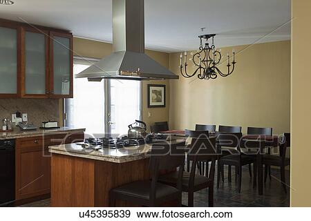 Stock Photo - Kitchen and dining area in traditional home; Burbank; California; USA. Fotosearch